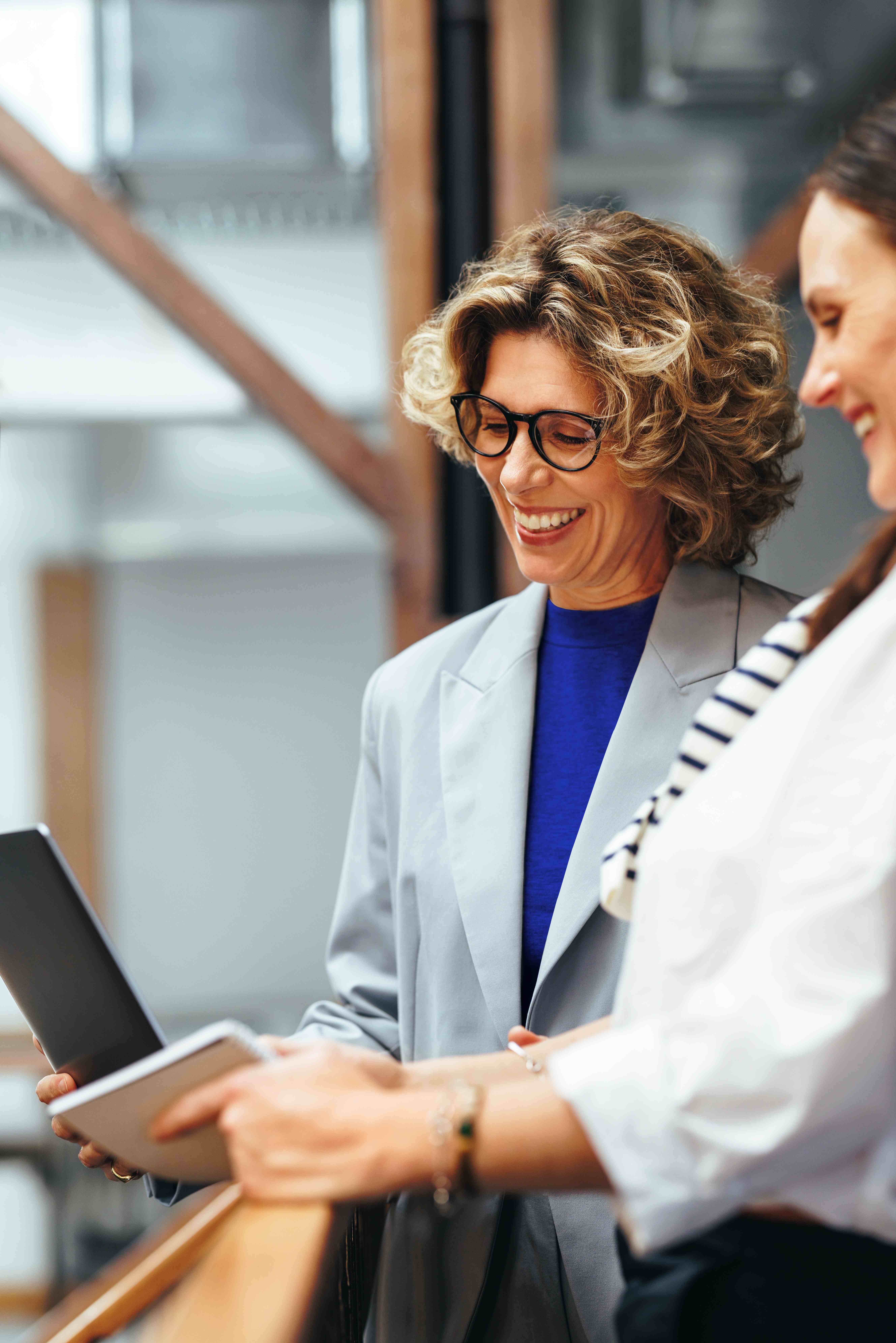 Woman laughing in an armchair
