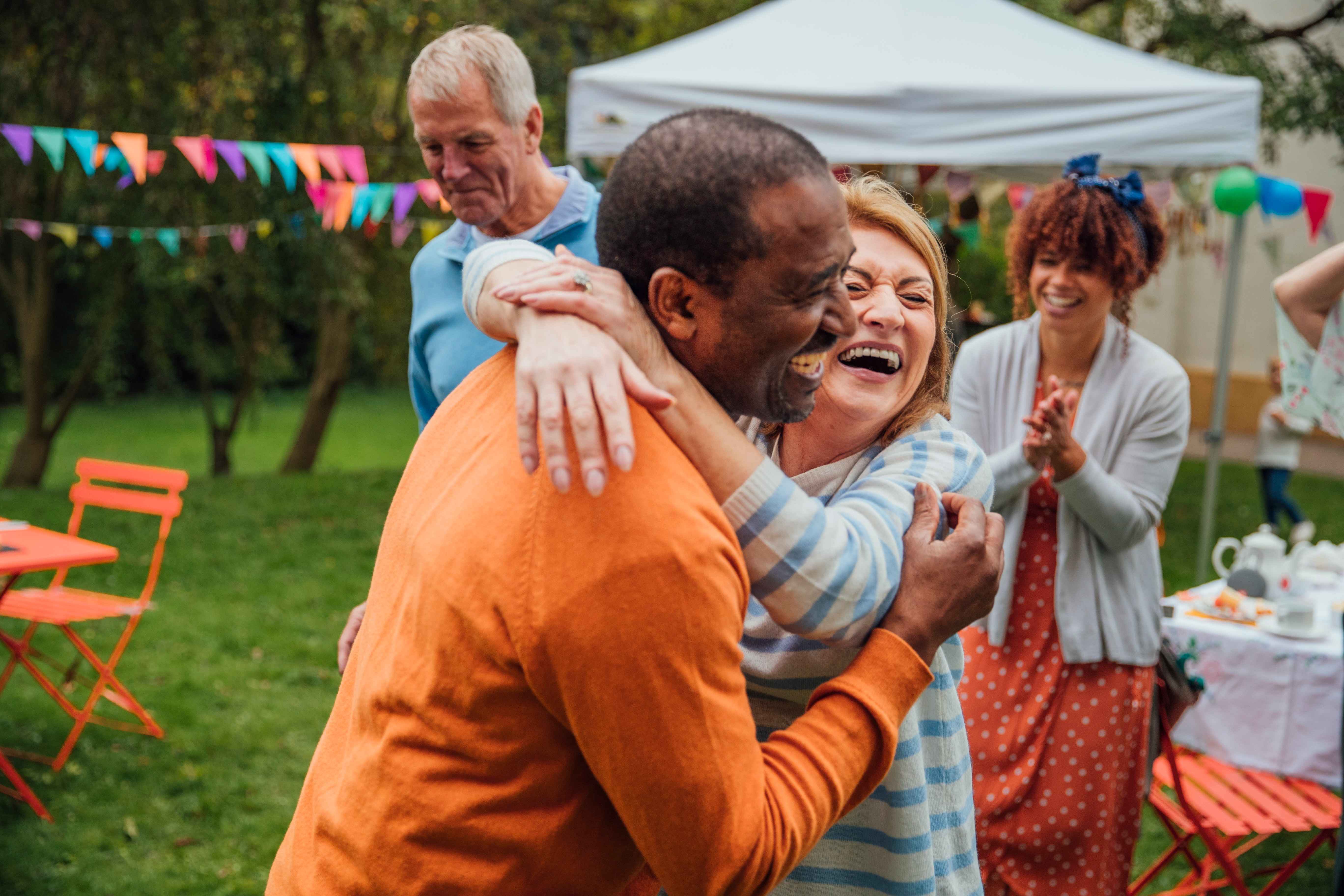 Mother and daughter flying a kite in a park