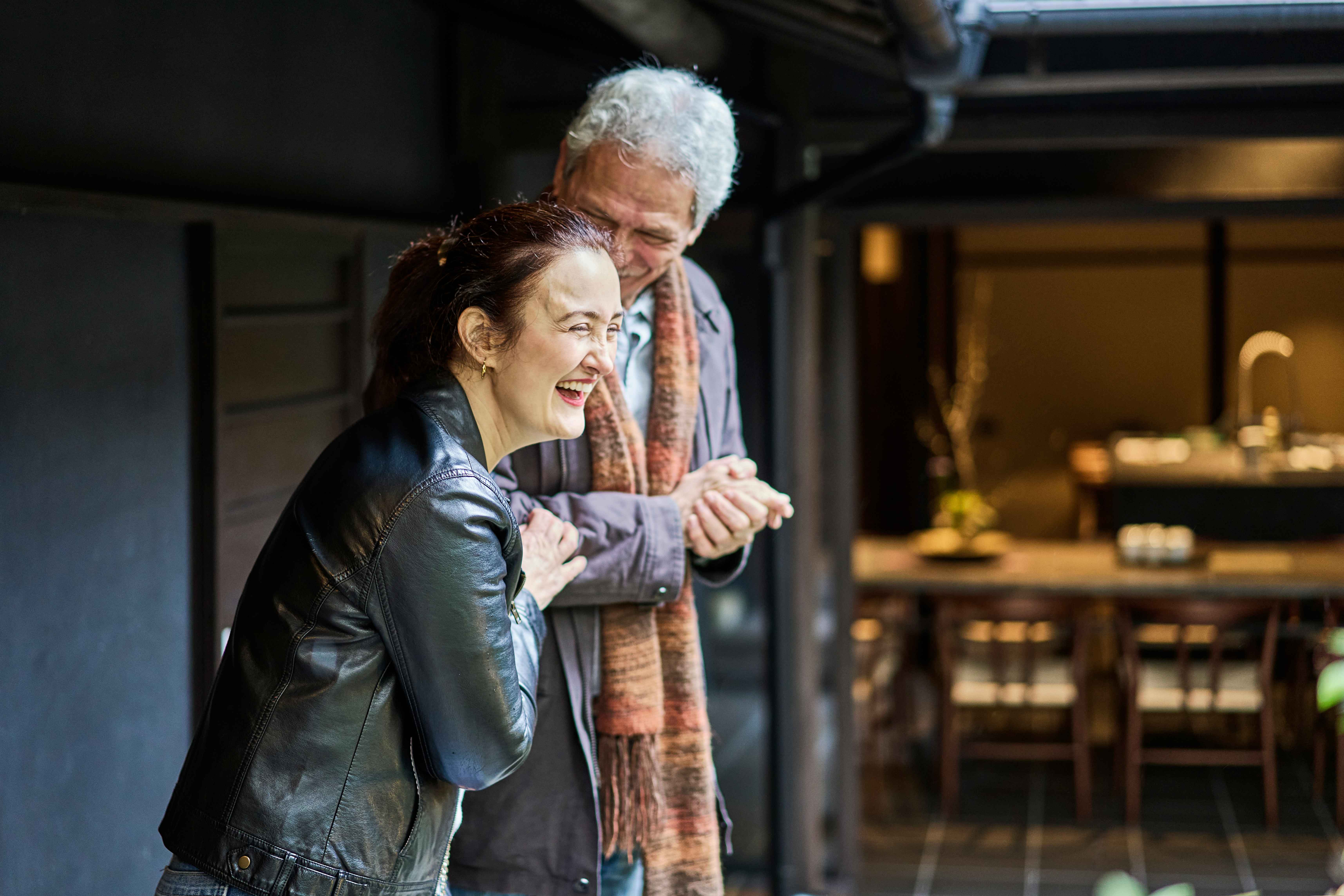 Grandfather and daughter laughing