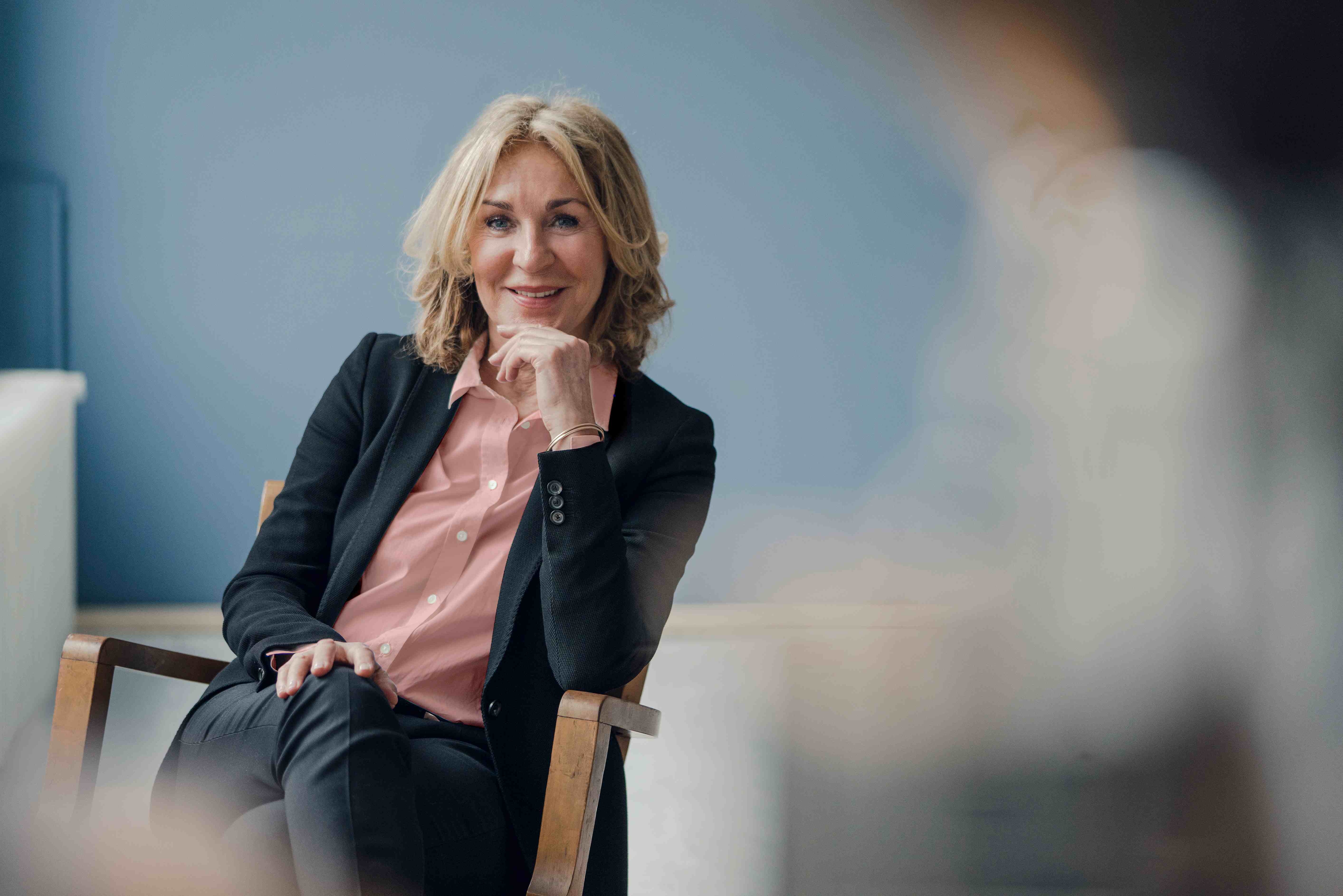 Woman looking wistfully out the window