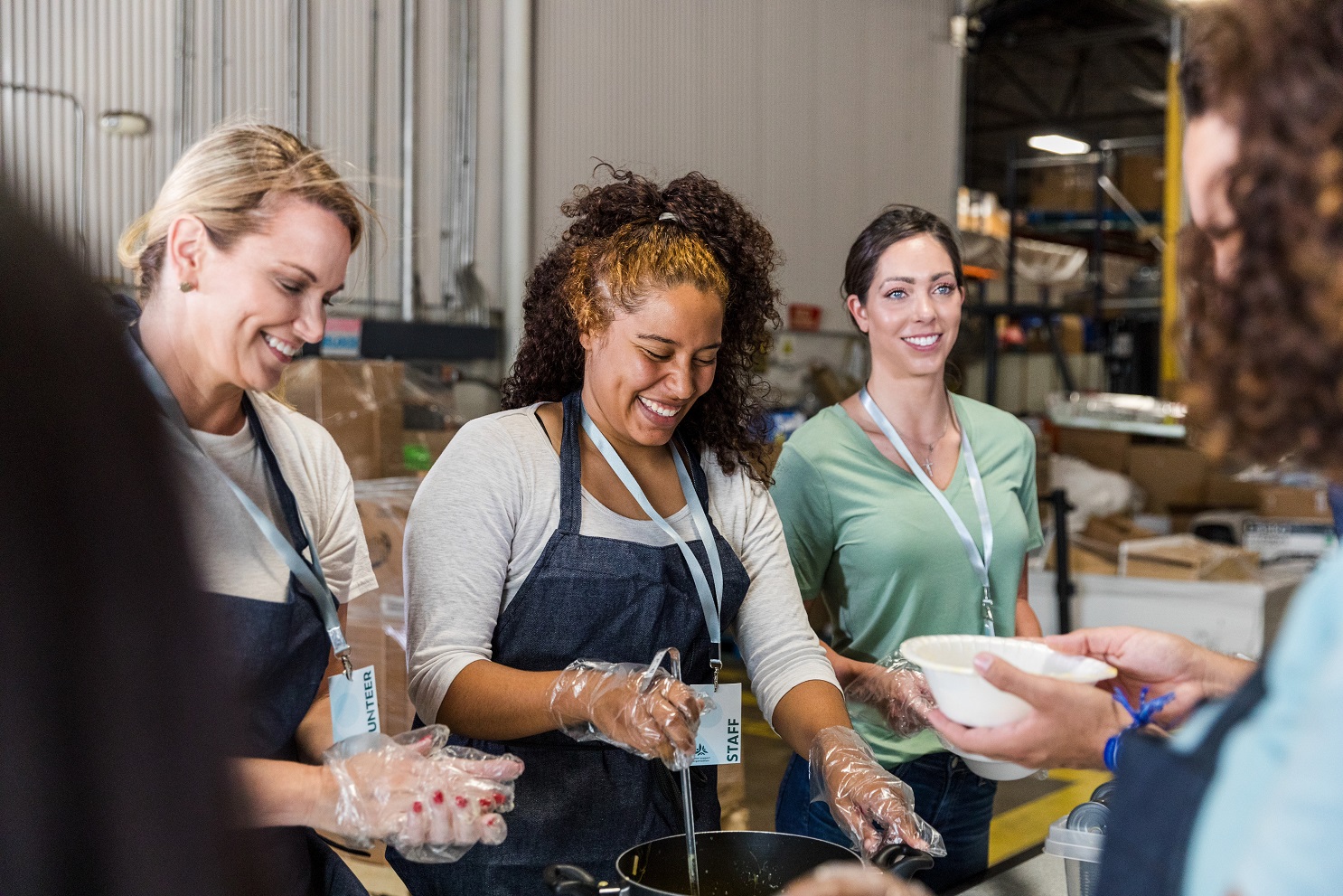 A group of people at an event discussing charity investment 