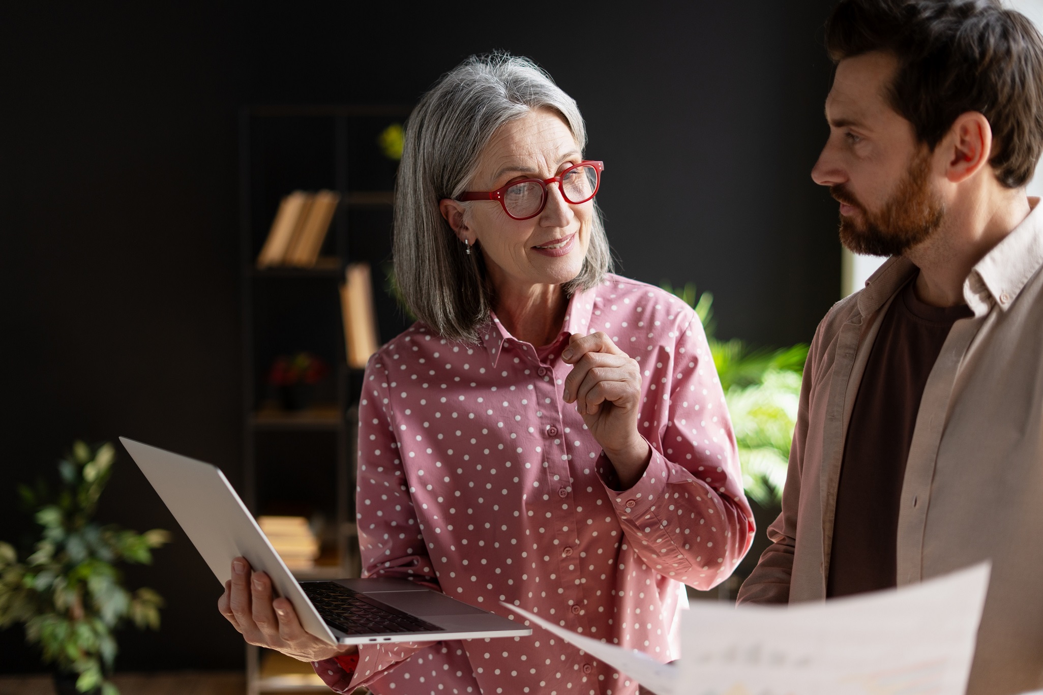 Two charity trustees discussing how their charity manage investment risk effectively