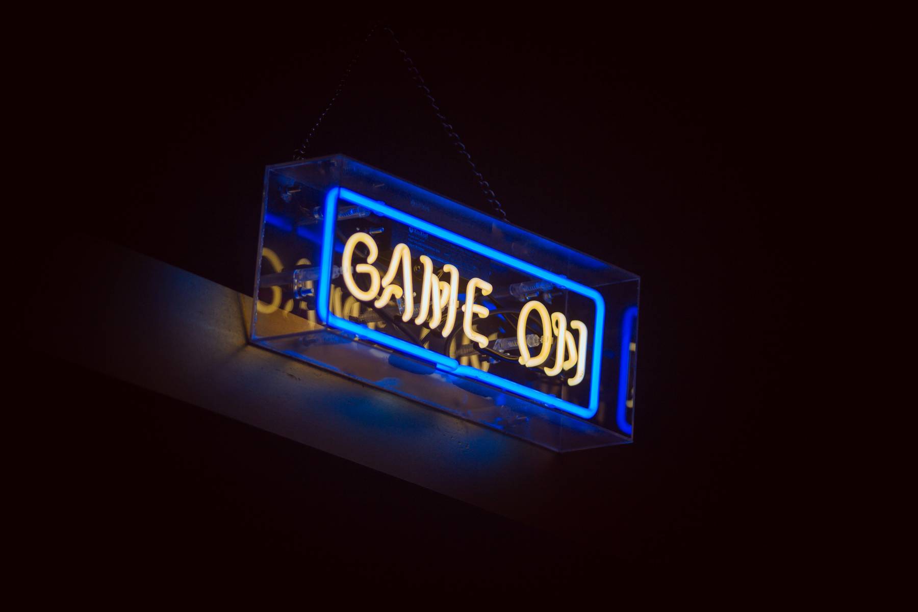 A neon light sign that says "Game on"