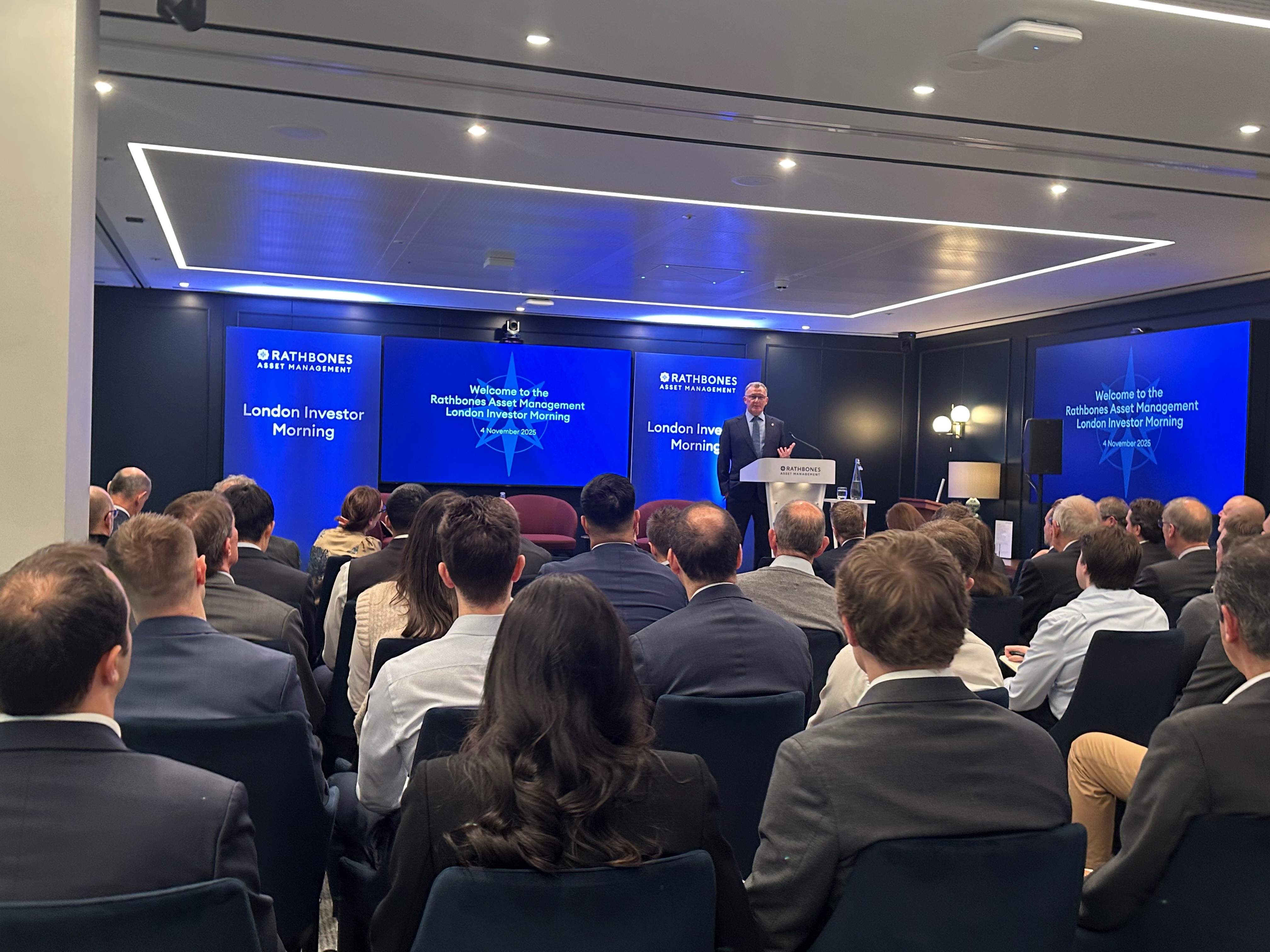 Image with people watching a conference 