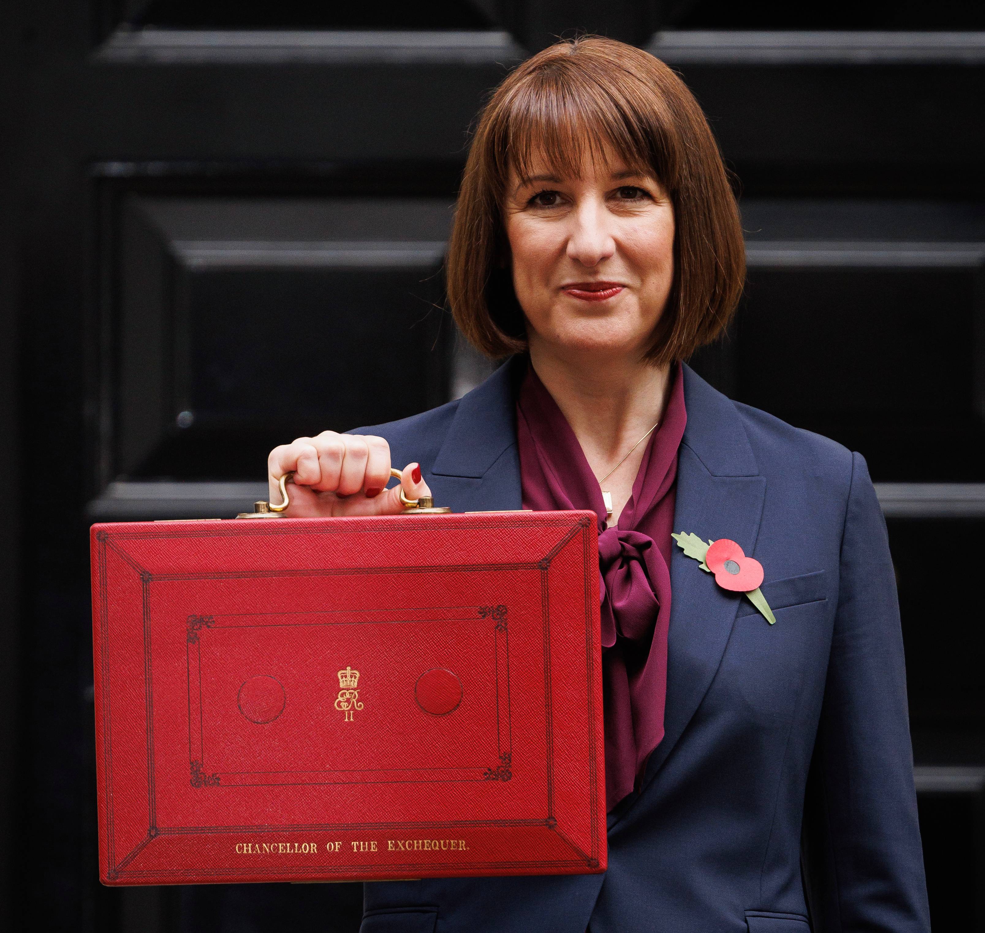 Chancellor Rachel Reeves holds red box outside number 11 Downing Street on Autumn Budget day 2024