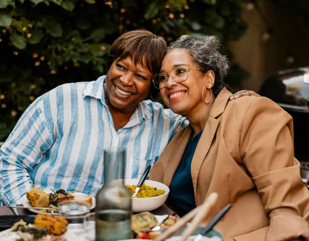 two women eating in an outdoor cafe