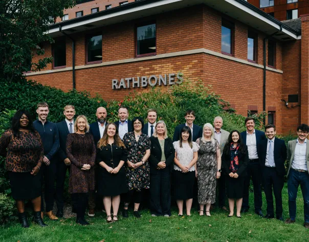 Meet the team of the Sheffield office standing outside the office building