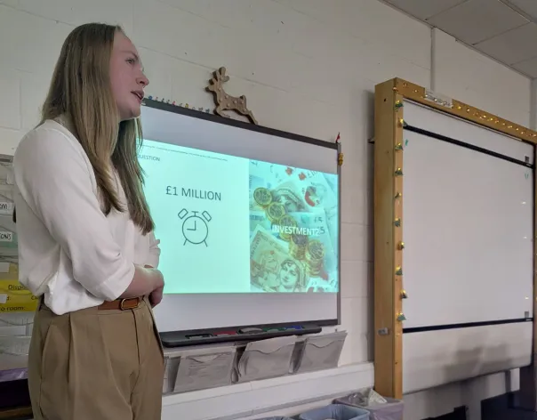 A member of Rathbones' Social Mobility Network presents to school children in their classroom about career progression
