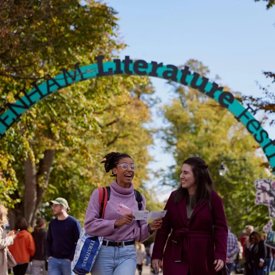 Two attendees of the Cheltenham Literature Festival walk and talk