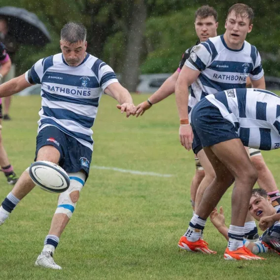 A Heriots Rugby Club player kicks out of a ruck