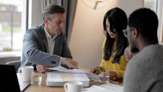 Charity trustees sat down having a meeting