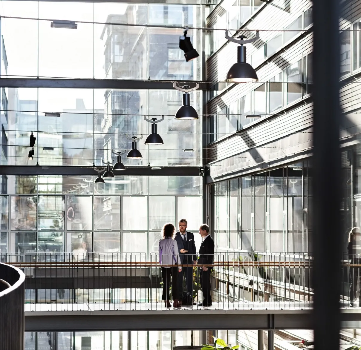 People stood talking in an office building