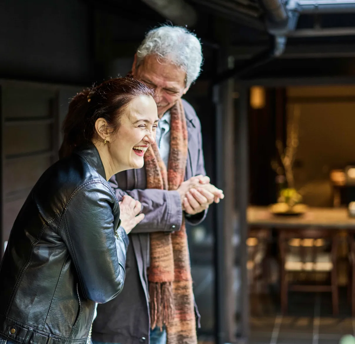 Grandfather and daughter laughing