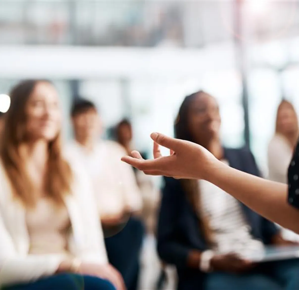 A person speaks at an event to an audience