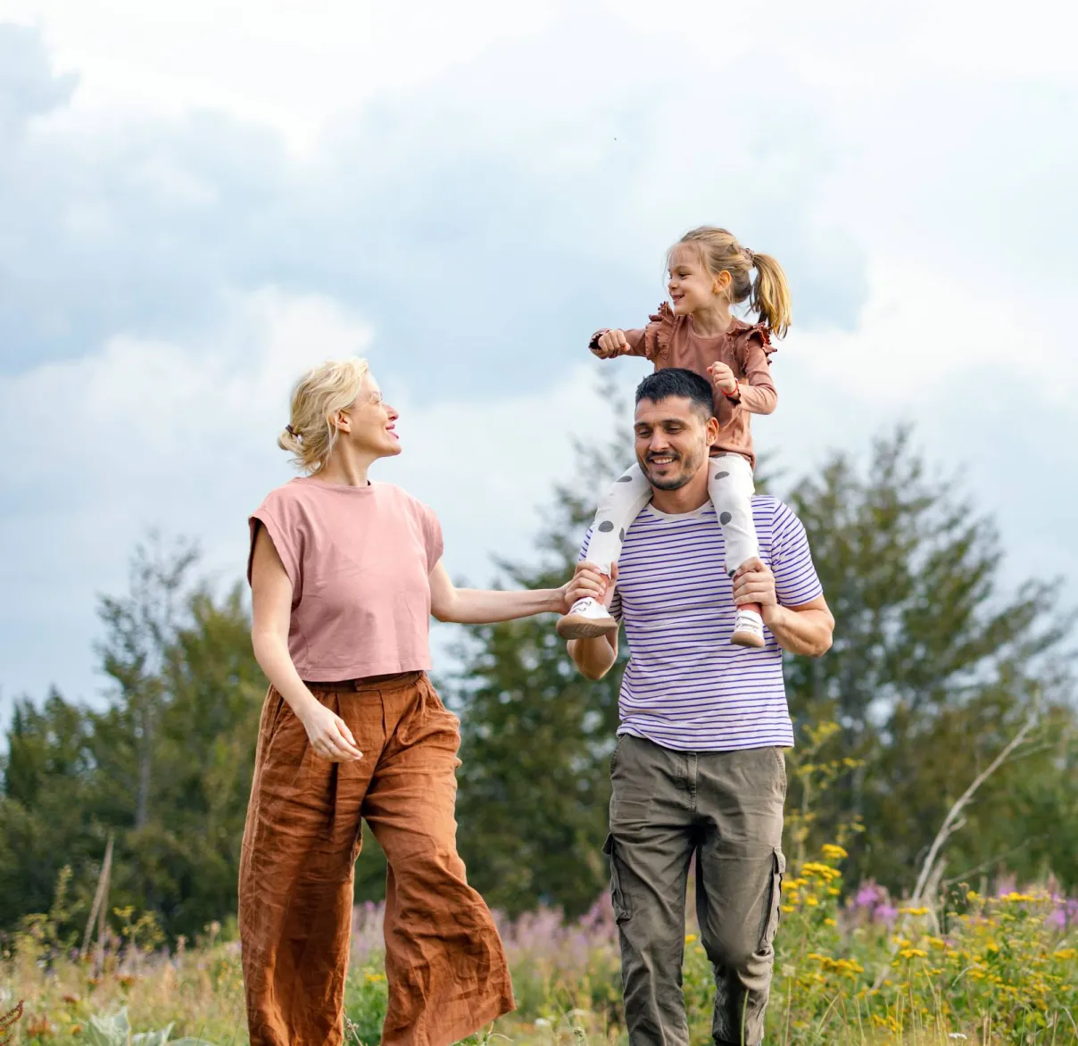 A family walk through the outdoors together
