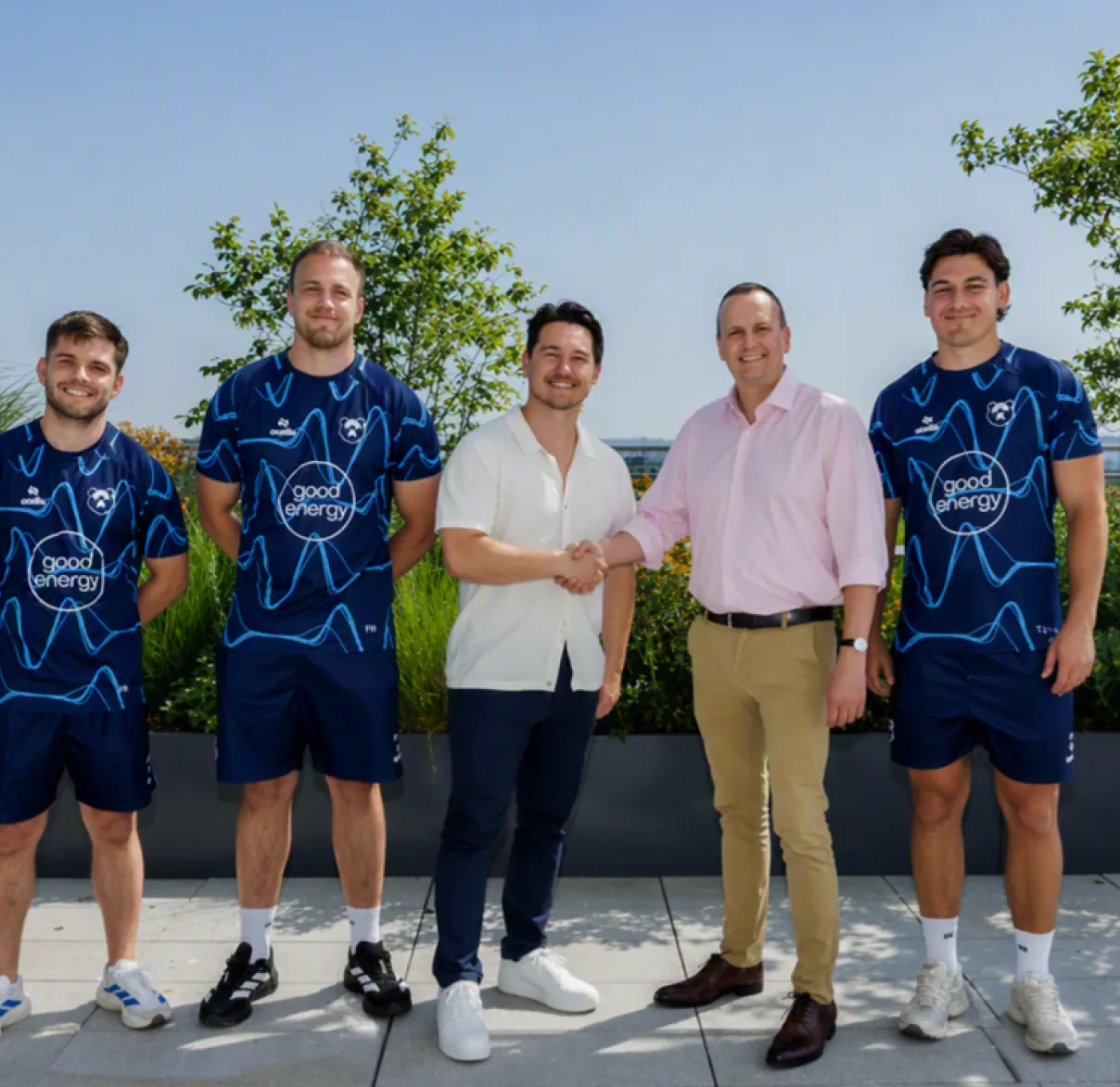 Rathbones' Scott Jones shakes hands with Bristol Bears players