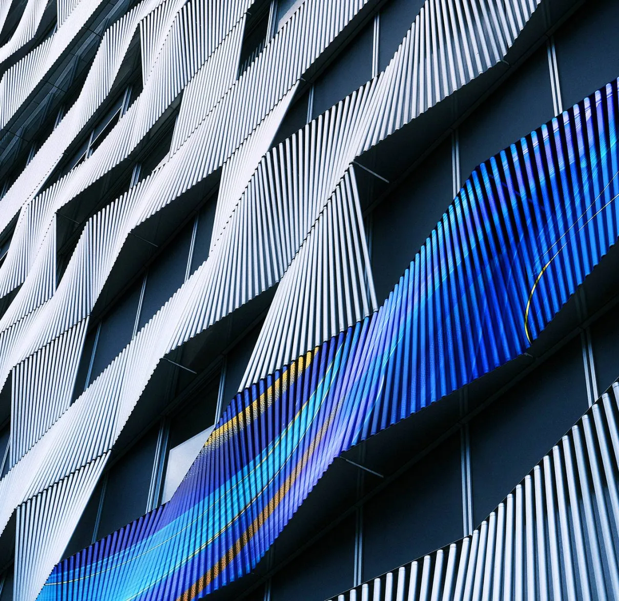 A close-up view of the metal railing on the side of a high-rise building