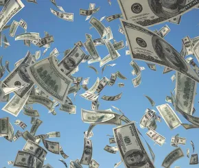 Dollar bills falling from sky