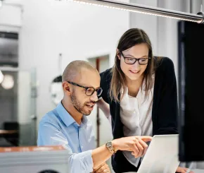 colleagues working at laptop