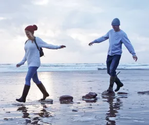 Couple walking on a beach together