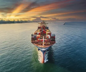 freighter ploughing through sea