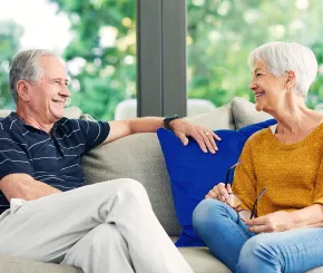 Couple on sofa talking