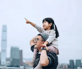 Father and daughter in the city