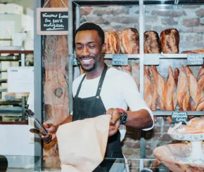 Smiling man working in a bakery