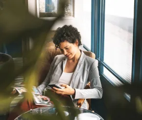 Businesswoman relaxing in hotel lobby