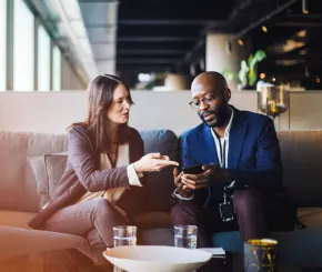 Professional man and woman in discussion