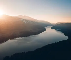 Lake with sunrise in background