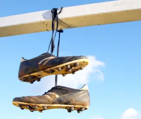 Football boots hanging by their laces