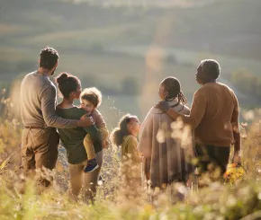 Happy family looking out on the countryside