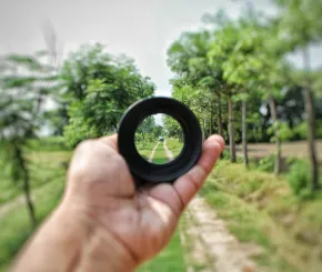 focus on distance in a farmer's field looking through a lens investment insights