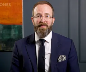 screengrab of Ed Smith wearing smart suit from video Investment Update thumbnail
